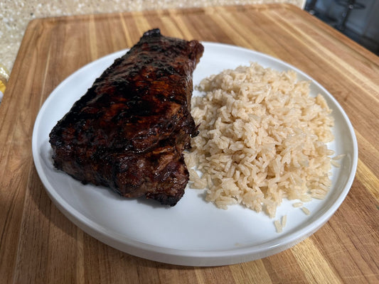 Guava-glazed steak with island shoyu lacquer served over coconut rice, Hawaiian plate-lunch style